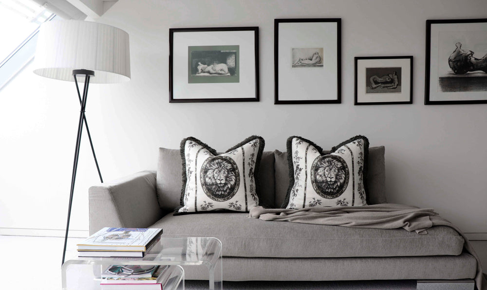 The Vale Home Cushions featuring lions on a day bed in a modern living room